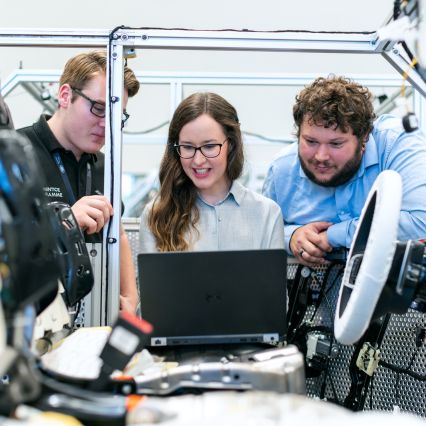 two young make and female apprentices with skilled water engineer - skills shortage in the UK water industry